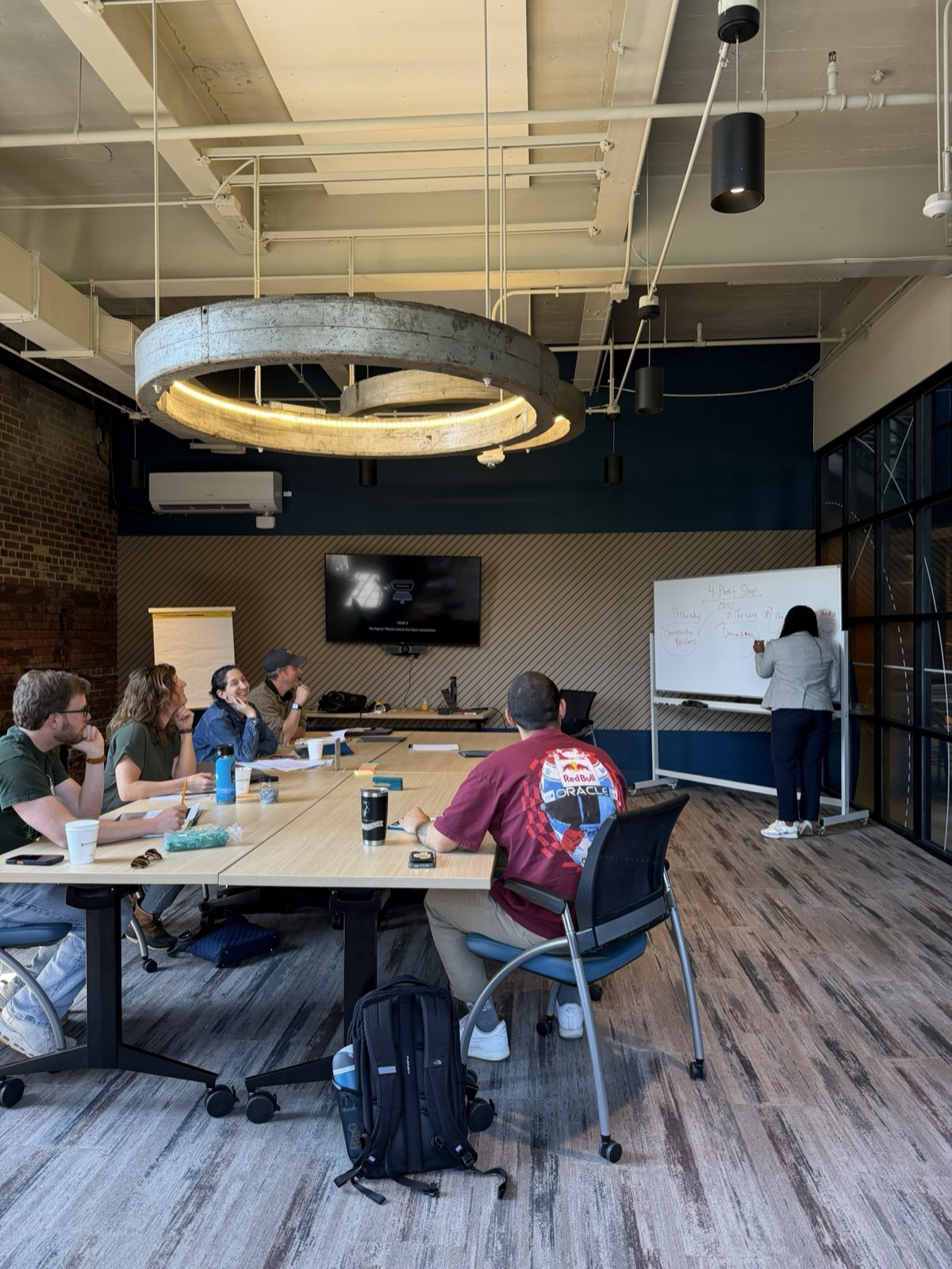 Latoya Robinson at the whiteboard with the Community Design Studio board during their fund development workshop, April 11, 2026